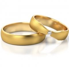Złote obrączki ślubne o ciekawym kształcie cyrkonią/diamentem próby 585